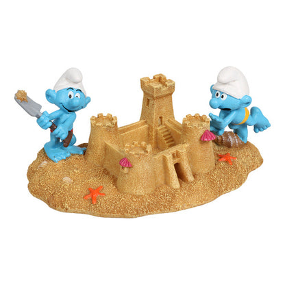 schluempfe bauen eine sandburg figur